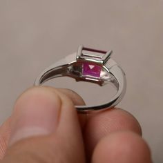 This is a gorgeous handmade creation. Its beauty is its simplicity & Elegance. The 7*7 mm square shape faceted lab ruby is crafted in solid sterling silver and with rhodium plated. All item is sent in a beautiful gift box If you have any idea of design your ring,pls contact me directly. You can realize more lovely stuff clicking the link https://www.etsy.com/shop/knightjewelry?refshopsection_shophome_leftnav Please leave the correct address and you phone number for delivering successfully. Silver Square Cut Birthstone Rings, Rectangular Ruby Ring With Polished Finish As Gift, Asscher Cut Ruby Jewelry With Center Stone, Fine Jewelry Ruby Rings With Rectangular Stone, Fine Jewelry Ruby Ring With Rectangular Stone, Rectangular Ruby Jewelry In Silver, Rectangular Silver Ruby Jewelry, Rectangular Ruby Ring Fine Jewelry, Rectangular Ruby Ring In Fine Jewelry Style