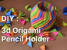 an origami pencil holder made out of colored paper and folded up with the words diy 3d origami pencil holder