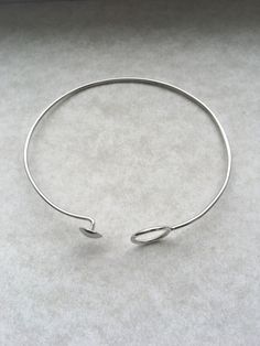 handmade Silver open circle bracelet. Dainty, minimalist, and stackable. Modern Adjustable Hoop Cuff Bracelet, Modern Adjustable Hoop Bracelets, Minimalist Hoop Sterling Silver Bracelets, Minimalist Sterling Silver Hoop Bracelets, Minimalist Adjustable Sterling Silver Oyster Bracelet, Adjustable Minimalist Cuff Bracelet, Adjustable Minimalist Round Cuff Bracelet, Modern Circle Bracelets For Everyday Wear, Modern Everyday Circular Bracelets