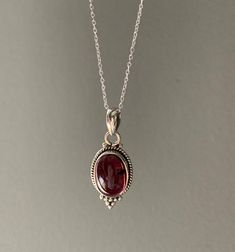 Sterling silver teardrop Garnet necklace. Ideal gift for her.Matching earrings available. Dainty Silver Drop Necklace Gift, Silver Dainty Drop Necklace As Gift, Silver Teardrop Pendant Jewelry For Mom, Sterling Silver Oval Pendant Necklace As Gift For Mom, Oval Sterling Silver Necklace For Mom, Silver Oval Pendant Jewelry For Mom, Sterling Silver Oval Necklace For Mom, Silver Oval Pendant Jewelry As Gift For Mom, Silver Teardrop Pendant Necklace For Mom