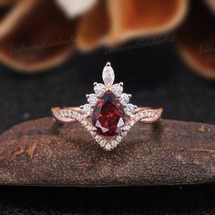 Vintage Pear Garnet Engagement Rings Red Gemstone Ring Vintage Half Eternity Wedding Ring Antique Moissanite Cluster Ring Anniversary Gift RING DESCRIPTION ✦Engagement Ring ✴Center Stone - Garnet Size - 6*8mm ✴Side Stones - Moissanite Shape - Round Cut Weight - About 0.448ct ✴Band Width - About 1.7mm ✴Ring Metal: Available in rose gold plated, yellow gold plated, 925 sterling silver, 10k or 14k solid rose, yellow or white gold. MAKING & SHIPPING ✦PAYMENT PLAN ♡ We provide layaway plans which can Red Cluster Ring With Brilliant Cut For Wedding, Elegant Ruby Wedding Ring With Halo, Red Brilliant Cut Cluster Ring For Wedding, Red Wedding Cluster Ring With Brilliant Cut, Anniversary Ruby Ring With Moissanite Center Stone, Ruby Moissanite Ring With Center Stone For Anniversary, White Gold Ruby Ring With Halo For Wedding, Red Brilliant Cut Rings For Wedding, Red Brilliant Cut Wedding Rings