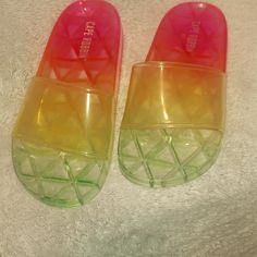 Clear Multicolored Sandals Never Worn Summer Slip-on Slides With Translucent Outsole, Multicolor Slip-on Slides For Summer, Trendy Multicolor Sandals For Spring, Casual Slides For Summer Parties, Casual Party Slides For Summer, Casual Summer Party Slides, Trendy Multicolor Slide Sandals, Trendy Multicolor Sandals For Beach Season, Casual Multicolor Jelly Sandals