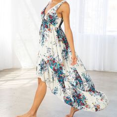 Brand New With Tags! An Ultra-Flattering Silhouette Meets Dreamy Watercolor Floral Print. Our Effortless Maxi Dress Features A High/Low Hemline, A Flattering Empire Waist With A Front Tie, And A Sexy Open Back With Tie Closure. The Tiered Skirt Adds Movement And Shape To This Gorgeous Style. Watercolor Floral Print Relaxed Fit Sleeveless Maxi Length High/Low Hemline Tiered Skirt V-Neckline Tie-Front Detail With Tassels Open Back With Tie Closure Partially Lined Self 100% Rayon Lining 100% Polyes Summer Floral Print Maxi Dress With High-low Hem, Spring Bohemian High-low Hem Maxi Dress, Beach Dress With Floral Print And High-low Hem, Bohemian Floral Print Dress With High-low Hem, Bohemian Dress With Floral Print And High-low Hem, Spring High-low Hem Maxi Dress For Beach, Summer High-low Hem Maxi Dress For Vacation, Spring Floral Print Maxi Dress With High-low Hem, Sleeveless Floral Print Maxi Dress For Daytime