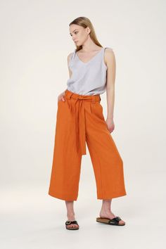 BARI pants have zipper closure and belt (can be removed), they are elegant and comfortable to wear in any occasion. Wear with sandals or high heels. Colors in pictures Powder Blue & Tangerine Combined with EVA top in French Gray color MILA top in Beige color --------SIZING GUIDE BODY-------- SIZE S Chest 88 cm / 34.6 in Waist 72 cm / 28.3 in Hip 96 cm /37.8 in Our Model size is Height 174 cm / 68.5 in Chest 84 cm / 33.1 in Waist 63 cm / 24.8 in Hip 91 cm / 35.8 in And she is wearing size S Garme Versatile Belted Bottoms For Summer, Versatile Belted Summer Bottoms, Versatile Summer Belted Bottoms, Belted High-waisted Wide Leg Pants For Summer, Casual High Waist Culottes With Belt Loops, Casual Belted Wide Leg Pants For Summer, Casual Summer Wide Leg Belted Pants, Casual Summer Belted Wide Leg Pants, Versatile Capri Length Pants For Summer