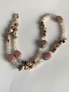 "Crystal Necklace, Pink Zebra Jasper, Rose Quartz, Rhodonite necklace.  Beautiful necklace made out of Pink Zebra Jasper,  Rhodonite and Rose Quartz an assortment of pink gemstones. All natural gemstones beads have their own unique markings and colors making this necklace truly stunning. Lobster Claw Clasp, Measures 20.5\" length. *FREE SHIPPING  *Gift box available" Pink Opal Round Beads Necklace For Gift, Pink Double Strand Necklace For Gift, Pink Hand-strung Necklace As Gift, Pink Hand-strung Necklace For Gift, Pink Pendant Crystal Necklace With Natural Stones, Pink Opal Gemstone Necklace, Pink Necklaces With Natural Stones As Gift, Pink Necklaces With Natural Stones For Gifts, Handmade Pink Opal Beaded Necklace For Gift