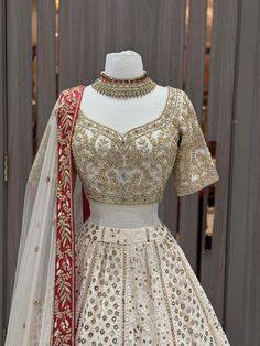 Elevate your bridal style with our ethereal white lehenga embellished with exquisite Lucknowi work and with crystal work embroidered blouse. The delicate thread embroidery and intricate motifs create a mesmerizing ensemble, symbolizing grace and sophistication. Embrace the essence of timeless beauty as you make memories on your special day. Fabric: Lucknowi Georgette WASH CARE INSTRUCTIONS - Please Dry clean only when it is applicable Ready to Ship! Crystal Work, White Lehenga, Thread Embroidery, Bridal Lehenga, Embroidered Blouse, Bridal Style, Timeless Beauty, Lehenga, Care Instructions