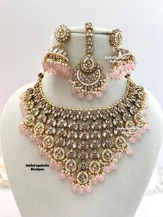 Premium quality Kundan Necklace comes with Jhumki Earrings and Tikka/ Indian Jewelry/Premium Quality Polki and Kundan Jewelry/Pink   All items are shipped from Brampton, Ontario, Canada. If you need your item by a certain day, please reach out to us for express delivery option before placing the order so that we can update the shipping for you. Standard shipping/delivery timeline Below are the delivery timeline estimates. We dispatch all orders by the next business day. ---> USA delivery timeline * 3-5 business days to major urban centers in USA. It may take 1-2 days extra to remote locations ---> Canada delivery timeline  * 2-3 business days - GTA  & Montreal  * 2-4  business days - Rest of Ontario/Quebec * 2-6 business days-  Rest of Canada    ---> Europe/Middle East timeline * 5-10 busi Luxury Pink Kundan Choli, Luxury Pink Bridal Necklace For Festivals, Luxury Pink Stone Work Bridal Necklace, Pakistani Bridal Jewelry Pink, Luxury Pink Bridal Necklace With Stone Work, Nikkah Pink Jewelry, Necklace Set For Pink Lehenga, Luxury Pink Bollywood Style Necklaces, Luxury Pink Cutdana Jewelry