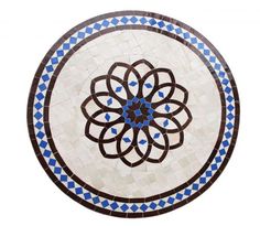 a blue and white circular tile with an intricate design