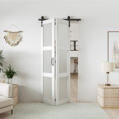 a living room with white walls and furniture