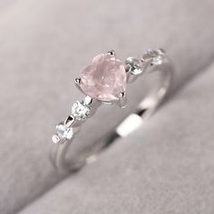 ◆ The ring is handcrafted from sterling silver and decorated with a dazzling 6*6 mm natural rose quartz and tiny CZs. It is suitable for engagement/anniversary/daily occasion. ◆ Production Description: Main stone Type: Natural rose quartz Main Stone Shape: Heart cut Main Stone Size: 6*6 mm(0.76 ct) Side stone: CZ Metal: 925 Sterling silver - Other options available in the drop down menu ◆ Customization: √Free for Add Engraving √Other Metal Type Available √Other Gemstones & Shapes Available √ Cute Promise Rings, Desain Quilling, Quartz Engagement Ring, Cute Engagement Rings, Audio Room, Jewelry Accessories Ideas, Heart Shaped Rings, Girly Accessories, Fancy Jewellery