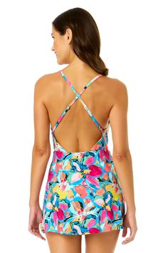 You'll love how confident you feel in our Swim Dress With Skirted Bottom. This one piece swim dress is designed with a colorful floral design making you the center of attention everywhere you go. With its skirted swim bottom, you can enjoy the beach in comfort whether you're relaxing by the pool or enjoying the water. Adjustable back straps and removable cups provide customizable support and a secure fit. Complete your look by pairing it with any Anne Cole cover up! Multicolor Swim Dress For Summer, Fitted Vibrant Print Summer Swimwear, Multicolor Spring Tankini For Poolside, Spring Multicolor Tankini For Poolside, Spring Multicolor Tankini Swimwear, Vibrant Fitted Swimwear For Vacation, Stretch Multicolor Swim Dress For Summer, Summer Floral Print Swim Dress For Pool, Blue Floral Print Swim Dress For Pool