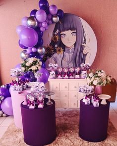 some purple and white decorations are in front of a pink wall with balloons on it