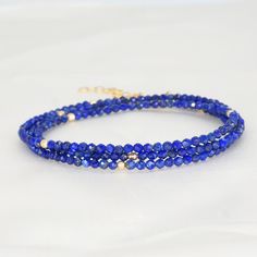 Lapis Lazuli enhances communication, increases truth and integrity, opens the third eye, allows for speaking one's truth, connects to spiritual and higher wisdom. A wrap bracelet that doubles as a necklace. 19" length with 1.5" extender 3mm gold filled spacer beads 14k gold fill or 92.5 sterling silver handmade in Los Angeles stones are approximately 2-3mm (with natural variation of colors) Please note that all gemstones will be slightly different than the one pictured. They will be similar in s Adjustable Hand Wrapped Necklaces For Layering, Adjustable Spiritual Necklaces For Layering, Multi-strand Bracelets With 108 Beads As Gift, Lapis Lazuli Bracelet For Meditation, Spiritual Multi-strand Wrap Bracelet Gift, Adjustable Multi-strand Spiritual Wrap Bracelet, Spiritual Single Strand Beaded Bracelets As Gift, Spiritual Single Strand Beaded Bracelet As Gift, Spiritual Multi-strand Hand Wrapped Bracelets