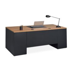 an office desk with a laptop on it