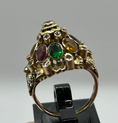 This gorgeous Vintage 18k Gold Princess Ring with Diamonds,Sapphire, Ruby Etc. size 6.9, weight 6.9grams. Antique Multi-stone Yellow Gold Cluster Ring, Victorian Multi-stone Yellow Gold Rings, Antique Multi-stone Cluster Ring In Yellow Gold, Antique Gold Cluster Ring With Multi-stone, Antique Multi-stone Gold Diamond Ring, Victorian Multi-stone Yellow Gold Diamond Ring, Victorian Sapphire Ring With 17 Jewels In 14k Gold, Yellow Gold Multi-stone Ruby Ring, Unique Multi-stone Ruby Ring In Yellow Gold