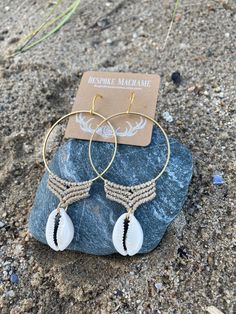 "Handcrafted micro macrame on a 2\" brass hoop with a puka shell charm. These boho beach vibe earrings will instantly transport you to vacation mode. Each shell is unique but I will careful select two that are as close to a pair as possible. Custom color cord options considered. Please DM your request." Nickel-free Bohemian Earrings For Beach, Bohemian Nickel-free Earrings For Beach, Bohemian Nickel-free Hoop Earrings For Beach, Handmade Bohemian Hoop Earrings For The Beach, Shell Dangle Hoop Earrings For Beach, Bohemian Shell Earrings For Beach Season, Handmade Dangle Hoop Earrings For Vacation, Bohemian Dangle Jewelry For Beach Season, Handmade Shell Bohemian Hoop Earrings