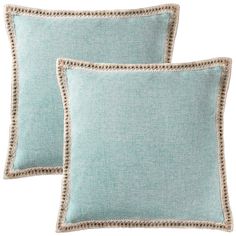 two light blue pillows on a white background