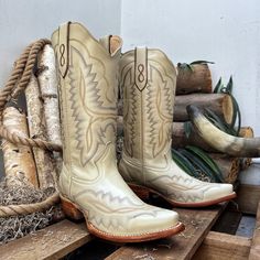 A women's western boot is a stylish and versatile footwear option that combines the classic design elements of a traditional cowboy boot with feminine touches and modern flair with a Eye-Catching Embroidery. These boots are specifically tailored to fit a woman's foot and offer a unique blend of fashion and functionality * Bone color and leather sole cowgirl boots for women with a 9 in boot shaft height and a 1.50-inch heel. * Premium leather construction sourced from Mexico, ensuring high-quality material. * Classic Western silhouette design provides a stylish and contemporary look, blending western charm with modern fashion. * Cowgirl boot that is Handcrafted by skilled artisans, offering authenticity and attention to detail in every stitch. * Designed for comfort with a cushioned insole Western Style Round Toe Heeled Boots For Ranch, White Western Boots For Western-themed Events, Western Beige Snip Toe Boots, Beige Western Snip Toe Boots, Beige Snip Toe Western Boots, Western Style Beige Heeled Boots, Southwestern Style Snip Toe Boots For Country Events, Country Style Snip Toe Heeled Boots For Rodeo, Western Style Moto Ankle Boots For Ranch