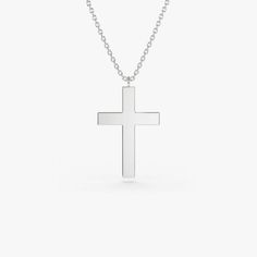 Gold KT: 14K Custom Gold Color: Rose Gold, Yellow Gold, White Gold Cross: 18 x 11 MM This 14k plain gold dangling cross necklace is a simple yet stunning accessory that will add a touch of sophistication to any outfit. The delicate gold chain holds a beautifully crafted cross charm that dances elegantly with every movement. Measuring approximately 18mm in size, this necklace is the perfect size for everyday wear, and the 14k gold construction ensures that it will last for years to come. Classic Sterling Silver Crucifix Necklace, Minimalist Cross Pendant Necklace For Formal Occasions, Classic Cross Pendant Necklace As Gift, Minimalist 14k Gold Crucifix Necklace, Minimalist Cross Pendant Jewelry For Formal Occasions, Minimalist Cross Pendant Jewelry For Formal Events, Classic White Gold Crucifix Necklace, Elegant Everyday Sterling Silver Cross Necklace, Classic White Gold Cross Necklace