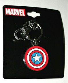 a captain america keychain with a star in the center on it's side