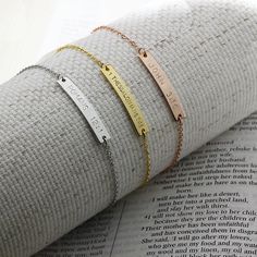 " Engrave your favorite Bible verse reference on this Bible Verse bracelet. This is a perfect gift for any occasion to remember God's Word. Please Give this Bible to your beloved ones on Christmas and Baptism. You may select engraving sides up to 2 and the color.  (Material) Bar: Gold Plated / Silver Plated / Rose Gold Plated Chain: Silver Plated /Gold Plated / Rose Gold Plated (Size) Bar: approx. 1.25\" Chain: 7\" *If you need length adjustment, please leave us a note at the checkout for the to Personalized Meaningful Name Bracelet Gift, Personalized Name Bracelet For Gift, Personalized Name Bracelet For Gifts, Customized Meaningful Name Bracelet As Gift, Meaningful Customized Name Bracelet As Gift, Customized Meaningful Name Bracelet For Gift, Customizable Inspirational Bracelet Jewelry, Customizable Name Bracelet For Meaningful Gift, Customizable Inspirational Name Bracelet As A Gift