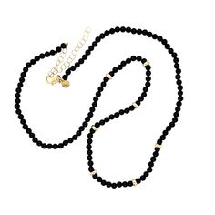 Add a special touch to your summer look! This 14K Gold Bead and Black Onyx Necklace is elegantly segmented with seven shining 14k beads and onyx stones. Size of Black Onyx Bead: Approx. 3mm Length: 16"-18" adjustable 14k yellow gold clasp and chain extension Single Strand Onyx Beaded Necklace With Round Beads, Classic Onyx Beaded Necklace With Black Beads, Elegant Black Beads With Gold Details, Elegant Onyx Necklace With Polished Beads, Elegant Black Beaded Chain, Classic Onyx Necklace With Black Beads, Elegant Onyx Black Beads, Elegant Black Onyx Beads, Elegant Gold Onyx Beaded Necklaces