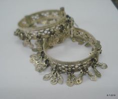 Vintage Antique ethnic collectible very nice tribal old silver charm Bracelet or bangle pair from Rajasthan India. Worn by Banjara tribal people of Rajasthan. Beautiful workmanship all over the piece, adorn with silver charms. One quarter-hinged part can be open by pin. Original old pair in good condition with great antique look. great pair for jeweley collection. Inner diameter across - 5.3 cm(2")Inner circumference -16.6 cm (6.5")width include charms - 2.6 cm(1")weight for pair - 92.5 gramsmat Nickel-free Traditional Bangle Jewelry, Silver Bangle For Festival, Silver Festival Bangle Jewelry, Bohemian Silver Bracelets For Festive Occasion, Bohemian Silver Bracelet For Festive Occasion, Silver Decorative Jewelry For Festivals, Ornate Handmade Metal Bangle, Handmade Ornate Metal Bangle, Festival Decorative Silver Jewelry