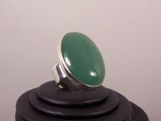 "The Aventurine gem is a beautiful green, is oval, cabochon 30 x 22.The ring band is 8 mm width.it is made with solid silver 925. *This jewel will be sent to you in a beautiful gift box * All the pieces are Hand Made * Custom order We will be glad to make any size, style, other gemstone or any other variation that you prefer. Usually it takes 1- 3 days. Reviews: \"Thank you very much! So pretty.\" \"Thank you for the beautiful ring, I love it!\"" Green Rings With Large Oval Cabochon Stone, Handmade Green Emerald Oval Cabochon Ring, Green Sterling Silver Oval Cabochon Jewelry, Vintage Green Oval Cabochon Jewelry, Green Oval Cabochon Gemstone Jewelry, Aventurine Ring, Aventurine Stone, Silver Rings Handmade, Green Gemstones