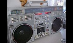 an old radio with speakers on top of it