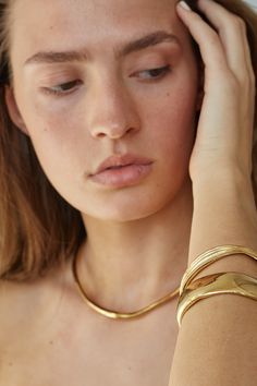 Discover the Elegance of Sustainable Jewelry . Our unique sustainable jewelry designs are not only ethically sourced and handcrafted, but they're also created with the modern woman in mind. Each piece is designed to make women feel beautiful, elegant, and powerful. Our craftsmen combine eco-friendly materials with unpa Gold Oyster Bracelet In Brass, Gold Oyster Bracelet Made Of Brass, Gold Brass Jewelry With Oyster Bracelet, Yellow Gold Polished Brass Bracelets, Tarnish Resistant Gold Brass Bracelets, Tarnish Resistant Yellow Gold Brass Cuff Bracelet, Elegant Gold Hand Forged Bracelets, Elegant Hand Forged Gold Bracelets, Minimalist Gold Jewelry With Oyster Bracelet