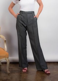 "Vintage 90s Kenzo wide-leg trousers. Great wide-leg silhouette trousers in a charcoal gray wool fabric. High-waisted. Band waist. Welt pockets. Pressed seam. Unlined. Front hook and eye and zipper fastening. We kindly ask that you please view all measurements for comparison so you can get your desired fit. Made in Paris. * Brand: Kenzo * Decade: 1990s * Fabric: 49% Viscose Rayon, 30% Wool, 21% Mohair Wool * Lining: Unlined * Color: Charcoal Gray C O N D I T I O N Excellent vintage condition, mi Formal Gray Wide-leg Pants, Gray Wide Leg Pants For Formal Fall Occasions, Elegant Gray Wide Leg Pants, Elegant Gray Full-length Wide Leg Pants, Classic Gray Wide Leg Pants For Work, Gray Formal Wide Leg Full Length Pants, Gray Wide Leg Full Length Pants For Formal Occasions, Formal Gray Wide Leg Pants, Classic Gray Wide Leg Dress Pants