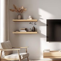 an empty living room with two shelves and a flat screen tv mounted on the wall