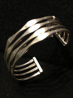 "Old Mexican Sterling Silver abstract modern cuff bracelet with attractive MCM style sculptural positive space-negative space design. Mexico & 925 stamps, plus another one I can't make out, possibly the hallmark of the maker? .75\" wide 5 1/8\" interior circumference plus 1 3/8\" flexible gap 25g 507R - This stunning piece is coming from an exciting relationship with a well known & popular Santa Fe, NM, jewelry gallery. I will be listing many exquisite pieces, some at lower prices than t Modern Sterling Silver Bracelet, Modern Jewelry With Unique Design And Open Band, Modern Adjustable Cuff Bracelet For Formal Occasions, Modernist Sterling Silver Bangle, Contemporary Adjustable Sterling Silver Bracelet, Modernist Polished Cuff Bangle Bracelet, Contemporary Sterling Silver Bangle Bracelet, Modernist Sterling Silver Bracelet, Contemporary Formal Cuff Bracelet Bangle