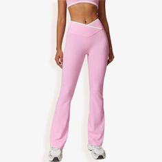 Elevate your workout or casual look with the Anna-Kaci Women's High Waist Crisscross Yoga Pants. These stylish yoga pants feature a flattering crisscross waistband design that enhances your silhouette while offering secure support. The soft, stretchy fabric allows for ease of movement, making them perfect for yoga sessions, gym workouts, or casual outings. The flare leg adds a trendy touch to these versatile pants, easily paired with crop tops, sports bras, or casual tees. Designed for both comf Waistband Design, Flare Yoga Pants, Bottom Workout, Versatile Pants, Casual Tees, High Waist Yoga Pants, Flare Leg Pants, Flare Leggings, Bottom Clothes