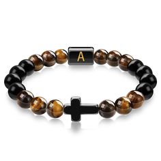 "This Item is Handmade" Enhance your spiritual journey with our Cross Tiger Eye Bracelet with Initial Charm. This exquisite piece is crafted from high-quality Tiger Eye stones, known for their protective and grounding properties. The beaded bracelet features a stylish cross pendant and a customizable initial letter, making it a perfect personalized bracelet for both men and women. Each handmade bracelet is meticulously designed to bring you good luck and protection. The durable elastic cord ensu Letter Making, Customized Bracelets, Tiger Eye Bracelet, Personalized Bracelet, Custom Initials, Tiger Eye Stone, Eye Bracelet, Personalized Bracelets, Initial Letter