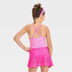 Dress up your fashionista for the beach or pool with the Leopard-Spot-Printed One-Piece Swimsuit Set from Cat & Jack™. This two-piece swimwear set includes a one-piece swimsuit with full lining and a crochet cover-up sarong with a side tie for a charming look. The swimsuit is covered with a pink leopard print and features crisscross straps on the back. Tailored from recycled polyester and stretchy spandex, this swimsuit set offers comfort all the time, whether they're diving, playing in the sand Fitted Tankini With Built-in Bra For Summer, One-piece Swim Skirt With Built-in Bra For Summer, Sleeveless Swim Dress For Beach Season, Summer Beach Season Tankini For Play, Summer Beach Tankini For Playwear, Summer Beachwear Tankini For Playwear, Summer Tankini For Beachwear, Stretch Summer Tankini, Playful Fitted Swimwear For Playwear