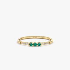 Celebrate the beauty of May with this dainty 14k or 18k solid gold emerald ring. A vibrant natural emerald takes center stage, complemented by a delicate diamond pavé band for a touch of sparkle. This minimalist design is perfect for stacking and makes a thoughtful birthday or birthstone gift. - Handmade - Solid Gold - Natural Diamonds and Emerald - Total Emerald Carat Weight: 0.09 ctw - Total Diamond Carat Weight: 0.05 ctw  - G Color, SI Quality Diamonds - Height of the Setting: 2.1 mm - Band Thickness: 1.3 mm 🛠 Your Sarah Elise piece is handcrafted with care! Ready-to-ship items go out within 3 business days. Made-to-order pieces typically take 7-10 business days to create. If you need something sooner, please contact us - we'll see if we can make it happen! For estimated shipping dates Yellow Gold Emerald Stackable Rings With Prong Setting, Yellow Gold Stackable Emerald Rings With Prong Setting, Yellow Gold Emerald Jewelry With Half Eternity Detail, Yellow Gold Stackable Emerald Birthstone Ring, Yellow Gold Emerald Birthstone Stackable Ring, Elegant Stackable Half Eternity Rings With May Birthstone, 14k Gold Emerald Ring Fine Jewelry, Yellow Gold Emerald Birthstone Ring Stackable, Timeless Yellow Gold Stackable Birthstone Ring