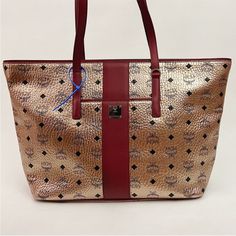 New Mcm Visetos Anya Champagne Tote Bag Msrp $780 Never Used 12”H X 18.5”W X 5.5”D Handle Drop 9.5” Zip Top Closure With Pockets Inside Mcm Bag, Mcm Tote Bag, Retro Tote Bags With Gold-tone Hardware, Black Mcm Bag, Mcm Handbags, Mcm Bags, Womens Tote Bags, Inside Pocket, Champagne