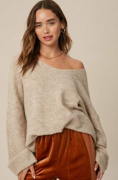 So chic and effortless, this slouchy, oversized tunic-style sweater features a v-neckline and dropped wide sleeves for added shape. -Available in Stone & Misty Blue -Waffle textured -V-neck -Oversized fit -Soft touch eyelash two tone yarn -Long sleeve with folded cuffs -Side slits -Ribbed on hem -Content: 74% Acrylic 22% Polyester 4% Lycra -Hand was cold/Line dry -Imported -Model is 5 8" 32-24-34 and wearing a size Small Oversized Tunic, Tunic Style, Style Sweater, Tunic Styles, Knitted Pullover Sweaters, Wide Sleeves, Oversized Sweater, Sweaters Oversized, Two Tone