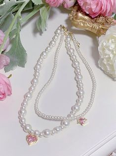 This price is for a necklace only, others are not included. Pearl Necklaces With Heart Shaped Beads, Pearl Necklaces With Heart Beads, Beaded Rhinestone Necklace Costume Jewelry Gift, Double Strand Pearl Necklace With Beads, Pearl Pendant Necklace With Heart Beads, Beaded Pearl Rhinestone Necklace For Gift, Pearl Beaded Rhinestone Necklace Gift, Pink Heart-shaped Bohemian Beaded Necklaces, Layered Beaded Necklace