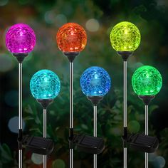 four different colored lights in the shape of balls