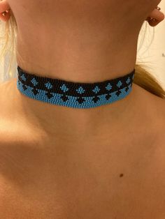 Hand beaded with premium Czech glass seed beads in black and cyan blue with premium Miyuki nylon threads. Pattern is a star like diamond. Lobster claw closure with a stainless steel chain collar. Beaded length is 12 inches with an extension of 2 1/2 inches. Hypoallergenic and nickel free. Bead Loom Choker, Turquoise Beaded Necklaces With Black Beads For Festival, Adjustable Beaded Choker, Adjustable Turquoise Bead Choker, Blue Beaded Necklaces With Tiny Beads For Party, Blue Tiny Beads For Party, Blue Beaded Necklace With Tiny Beads For Party, Adjustable Turquoise Beaded Chain Choker, Blue Beaded Necklace For Party