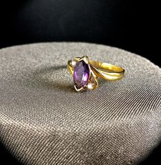 My Collection of Vintage rings from the Late 70's I have collected various rings over the years, but i think its time to share them with all of you!  RING INFO. * Size - 6 * .85 Carat Amethyst Natural Stone * 2 Diamonds are .05 Carat each  NOT YOUR SIZE? ›This ring can be resized to size 5, 7 or 8  ›Resizing this ring is included in the purchase price. On purchase, make sure to include the size you want it.  CUSTOMIZATION If this is a ring you like but you want to make it your own, contact me to Irish Earrings, Amethyst Ring Vintage, Diamond Ring Vintage, February Birthstone Jewelry, Vintage Cocktail Ring, Angel Earrings, Amethyst And Diamond Ring, Amethyst Gold, Custom Ring