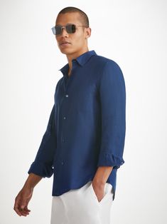 The Monaco shirt features a curved back yoke with a box-pleat for comfort and a curved hem with side vents for ease of movement. We've used the classic styling of a button-through front and cuffs, a 2-piece collar and for a modern addition, we've added a U-shaped breast pocket with a handy sunglass loop for effortless summer chic. For a final touch of luxe, the shirt is finished with mother of pearl buttons throughout and our minimalist rose logo label at the hem. There's also a handy 'locker' l Classic Tops With Cuffed Sleeves And Spread Collar, Classic Top With Cuffed Sleeves And Spread Collar, Long Sleeve Shirt With Concealed Placket For Summer, Timeless Relaxed Fit Tops With Button Cuffs, Classic Linen Tops With Button Cuffs, Timeless Relaxed Fit Top With Button Cuffs, Classic Tops With Placket And Shirttail Hem, Summer Long Sleeve Shirt With Concealed Placket, Classic Linen Tops With Fold Down Collar