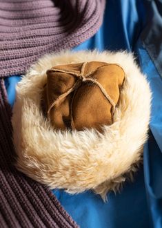 A big, fluffy genuine sheepskin hat with aﾠhuge brim. Made with only the best quality of genuine sheepskin from right here in the UK, this gorgeous ladies hat stands out from the crowd. We use big fluffy sheepskin rugs to make the brim, then the crown is made using super soft double face sheepskin - suede on the outer, with shorn fleece in theﾠinner, allﾠ out-seamed for a perfectly smooth and comfortable fit on the wearer's head. Our luxury sheepskin hats are expertly crafted by hand in the UK using genuine high quality natural materials. Sizing and fit. One size fits all. Eco Statement. Made with 100% sheepskin, sheepskin is a naturally biodegradable produce that has been sustainably sourced. Please recycle as a textile. Sheepskin Hat, Cloche Hats, Sheepskin Rugs, Hats Winter, Luxury Winter, Leather Workshop, Hat Stands, Winter Cold, Sheepskin Rug