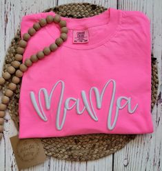 I love this Neon Pink Mama tee with 3D puff embroidery!  The perfect tee for Summer! Made with LOVE in Oklahoma.   Comfort Color 6.1 oz 100% ring spun cotton. Unisex sizing for a relaxed fit. Suggested sizes: S (0-4) M (6-10) L (10-14) XL (14-18) *Processing TIme* Please allow 5-7 days for production.  We ship USPS, normally allow up to 7 days for shipping. *Care Instructions* Wash inside out, cold.  Lay flat to dry.  Lightly iron if necessary, but NOT over the embroidery Return/Exchange Policy: Casual T-shirt With Embroidered Text For Mother's Day, Pink Crew Neck T-shirt With Embroidered Graphics, Pink T-shirt With Embroidered Text For Summer, Cute Pink T-shirt With Letter Embroidery, Pink Embroidered T-shirt For Summer, Pink Cotton T-shirt With Embroidered Graphics, Cotton T-shirt With Letter Embroidery For Birthday, Pink Embroidered Cotton T-shirt, Pink Short Sleeve T-shirt With Embroidered Graphics