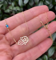 Very delicate and special ! The evil eye and Hand of Fatima is there for you to keep the negative energies away! ✨✨ P R O D U C T * D E T A I L S 14K Gold vermeil 925 Sterling Silver Size - 15.8 inches (~ 40 cm) 1.2 inches extension This necklace arrives in a charming gift package wrapped with love ❤️ . . . . . . . . . . . . . . . . . . . . . . . . . . . . . . . . . . . . . . . . . . ★ You can check out other lovely choices of jewelry in store Belita Design: https://www.etsy.com/shop/BelitaShop Dainty Evil Eye Jewelry For Good Luck, 14k Gold Evil Eye Jewelry Gift, Gold Evil Eye Jewelry For Blessing, 14k Gold Evil Eye Charm Necklace As Gift, Evil Eye Necklace Silver, Evil Eye Amulet, Rose Gold Choker, Gold Snake Chain, Hand Of Fatima