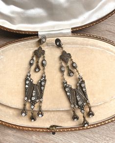 Absolutely stunning statement earrings which date to the late 1980s-1990s. I believe they were individually made by a designer-maker as they are signed on the back.  The  metal is probably bronze. They are studded with crystal rhinestones which could be Swarovski. The total length of the earring is 11cm = 4.2". Each earring weighs 11g which is not at all heavy. The condition is excellent. Please note the jewellery gift box in the photos is for display only.  All jewellery is sent in presentation Vintage Dangle Chandelier Earrings For Anniversary, Vintage Chandelier Dangle Earrings For Anniversary, Vintage Chandelier Earrings For Anniversary, Vintage Crystal Drop Earrings For Anniversary, Antique Metal Earrings For Party, Victorian Dangle Chandelier Earrings For Parties, Victorian Chandelier Dangle Earrings For Party, Formal Vintage Chandelier Earrings, Victorian Style Party Chandelier Earrings