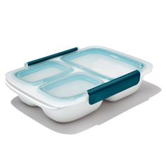 a blue and white plastic container with two compartments on the side, one compartment is divided into separate sections