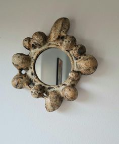 a mirror mounted to the side of a wall